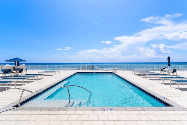 4511 S Ocean Blvd Unit 106, Highland Beach, FL 33487 - community pool featuring a patio and a water view