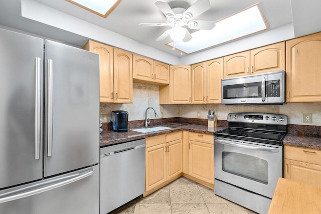 4511 S Ocean Blvd Unit 106, Highland Beach, FL 33487 - kitchen featuring appliances with stainless steel finishes, a sink, and light brown cabinetry
