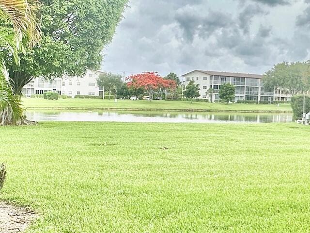 130 Brighton D, Boca Raton, FL 33434 - view of community featuring a yard and a water view