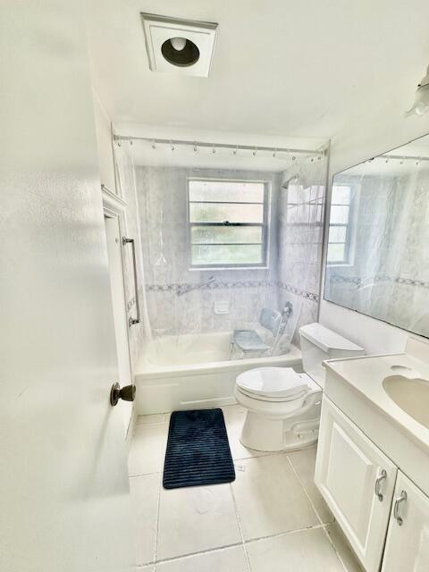 130 Brighton D, Boca Raton, FL 33434 - full bathroom featuring toilet, tile patterned flooring, vanity, and shower / tub combination