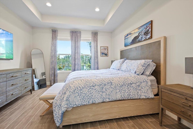 17936 Adrift Rd, Winter Garden, FL 34787 - bedroom featuring wood finished floors, a raised ceiling, and recessed lighting
