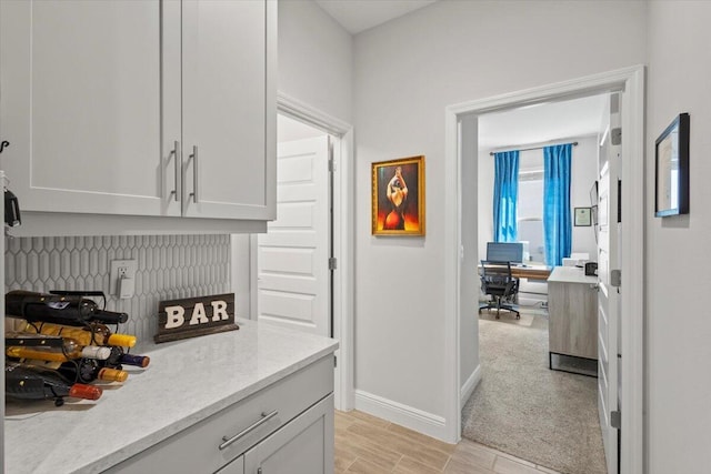 17936 Adrift Rd, Winter Garden, FL 34787 - bar area with baseboards and light wood finished floors