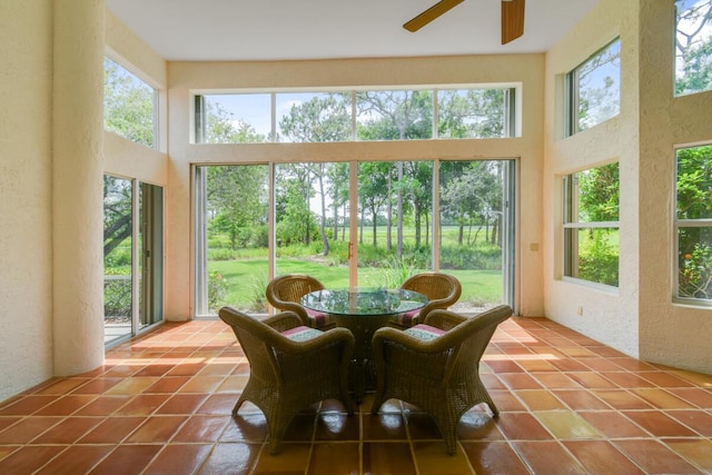 13312 NW Maplewood Rd, Palm City, FL 34990 - sunroom / solarium with a textured wall, a towering ceiling, and tile patterned flooring