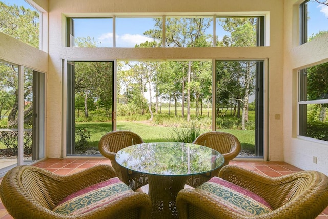 13312 NW Maplewood Rd, Palm City, FL 34990 - sunroom / solarium with tile patterned floors, healthy amount of natural light, and a towering ceiling