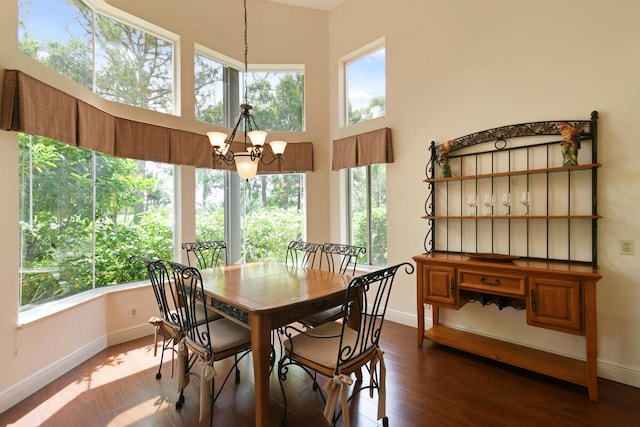13312 NW Maplewood Rd, Palm City, FL 34990 - dining area with a chandelier, plenty of natural light, and baseboards