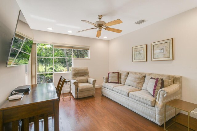 13312 NW Maplewood Rd, Palm City, FL 34990 - living room with a ceiling fan, wood finished floors, baseboards, and recessed lighting