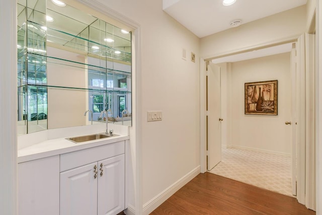 13312 NW Maplewood Rd, Palm City, FL 34990 - bar area with a sink, dark wood-type flooring, baseboards, and recessed lighting