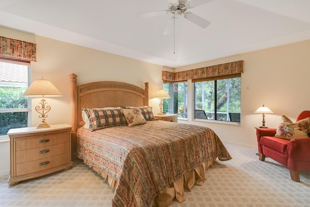 13312 NW Maplewood Rd, Palm City, FL 34990 - bedroom featuring light carpet, multiple windows, baseboards, and a ceiling fan