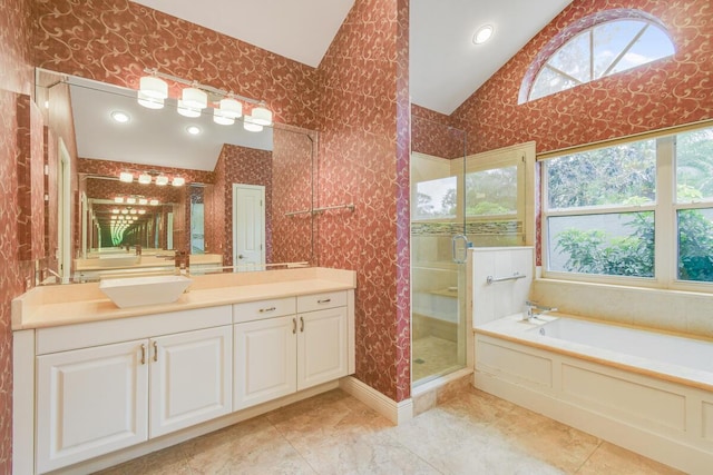 13312 NW Maplewood Rd, Palm City, FL 34990 - full bath featuring lofted ceiling, vanity, a shower stall, a garden tub, and recessed lighting