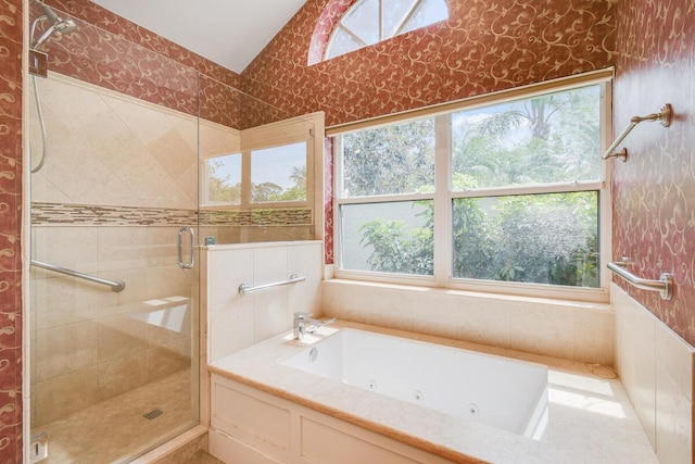 13312 NW Maplewood Rd, Palm City, FL 34990 - full bathroom with a tub with jets, a shower stall, and vaulted ceiling