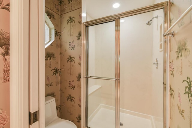 13312 NW Maplewood Rd, Palm City, FL 34990 - full bathroom with a stall shower, toilet, and wallpapered walls