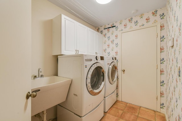 13312 NW Maplewood Rd, Palm City, FL 34990 - laundry area with washer and dryer, wallpapered walls, and cabinet space