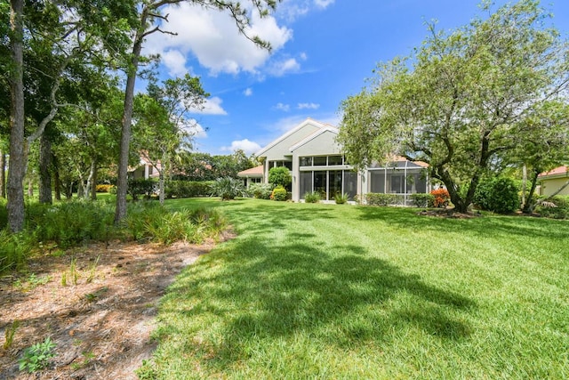 13312 NW Maplewood Rd, Palm City, FL 34990 - view of grassy yard with a sunroom