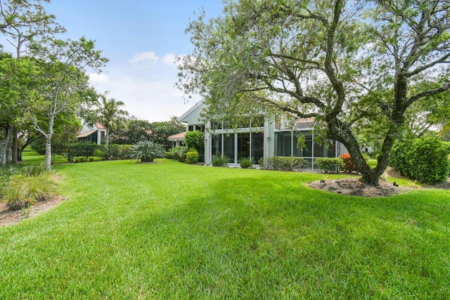 13312 NW Maplewood Rd, Palm City, FL 34990 - view of green lawn featuring a sunroom