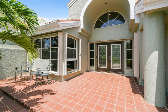 13312 NW Maplewood Rd, Palm City, FL 34990 - view of patio with french doors