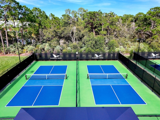13312 NW Maplewood Rd, Palm City, FL 34990 - view of tennis court featuring community basketball court