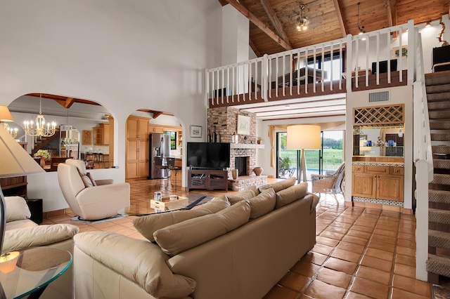 5898 Vista Linda Ln, Boca Raton, FL 33433 - living room with wood ceiling with exposed beams, high vaulted ceiling, arched walkways, a chandelier, and tile patterned floors