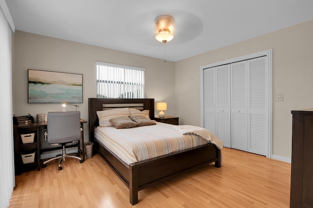 5898 Vista Linda Ln, Boca Raton, FL 33433 - bedroom with light wood-style flooring, a closet, and a ceiling fan