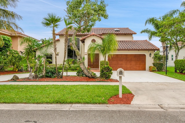 5898 Vista Linda Ln, Boca Raton, FL 33433 - mediterranean / spanish-style home featuring a tiled roof, a garage, stucco siding, driveway, and a front lawn