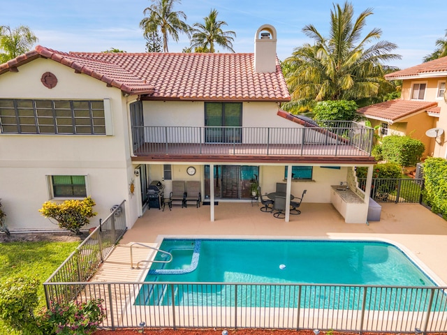 5898 Vista Linda Ln, Boca Raton, FL 33433 - rear view of property with a chimney, stucco siding, a balcony, a tile roof, and a patio area