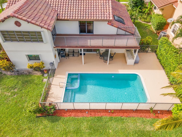 5898 Vista Linda Ln, Boca Raton, FL 33433 - back of property featuring a tiled roof, stucco siding, a patio area, and an outdoor pool