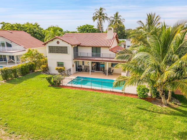 5898 Vista Linda Ln, Boca Raton, FL 33433 - back of property featuring a balcony, stucco siding, a tiled roof, a patio, and a chimney