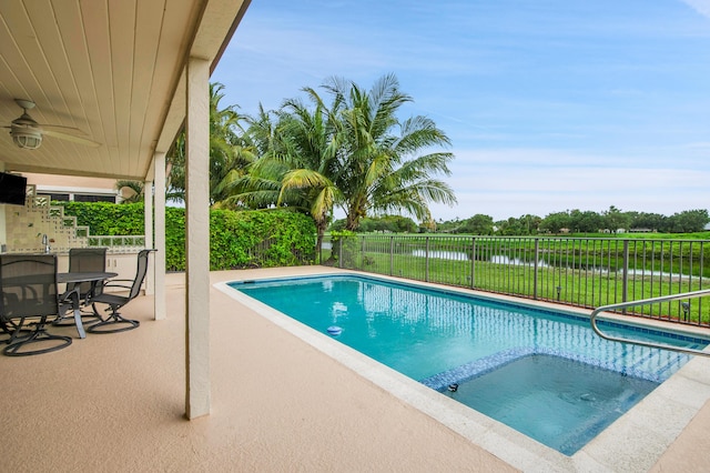 5898 Vista Linda Ln, Boca Raton, FL 33433 - view of swimming pool featuring a water view, a pool with connected hot tub, ceiling fan, and a patio