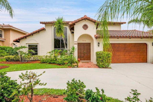 5898 Vista Linda Ln, Boca Raton, FL 33433 - mediterranean / spanish-style home featuring concrete driveway, stucco siding, a garage, and a tiled roof