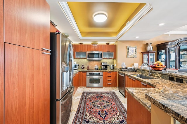 2640 Lake Shore Dr Unit 1510, Riviera Beach, FL 33404 - kitchen featuring appliances with stainless steel finishes, a sink, brown cabinets, light marble finish flooring, and crown molding