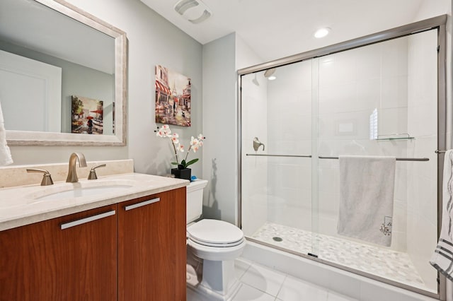 2640 Lake Shore Dr Unit 1510, Riviera Beach, FL 33404 - bathroom with vanity, toilet, a stall shower, and tile patterned flooring