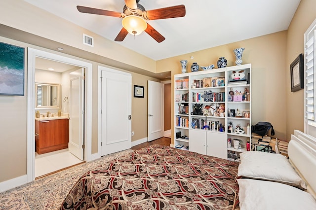 2640 Lake Shore Dr Unit 1510, Riviera Beach, FL 33404 - bedroom with ensuite bathroom, a ceiling fan, and baseboards