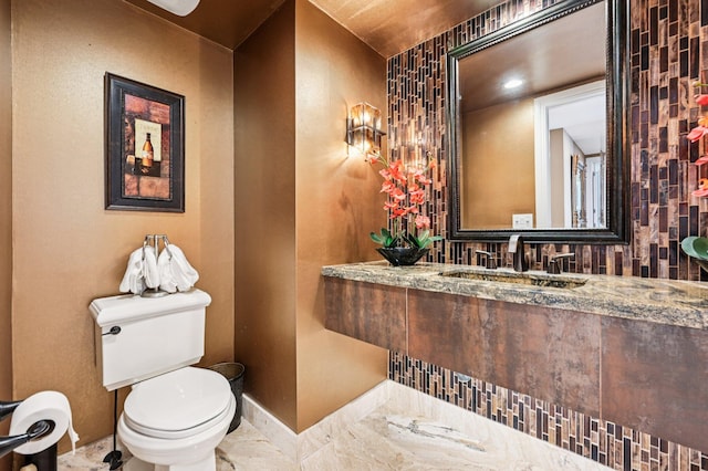 2640 Lake Shore Dr Unit 1510, Riviera Beach, FL 33404 - half bathroom with toilet, baseboards, and vanity