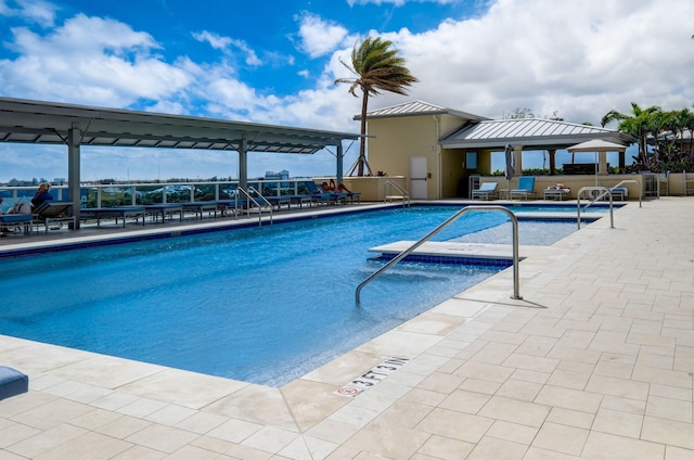 2640 Lake Shore Dr Unit 1510, Riviera Beach, FL 33404 - community pool featuring a patio