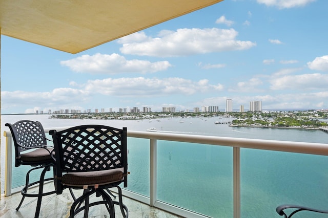2640 Lake Shore Dr Unit 1510, Riviera Beach, FL 33404 - balcony featuring a skyline view and a water view
