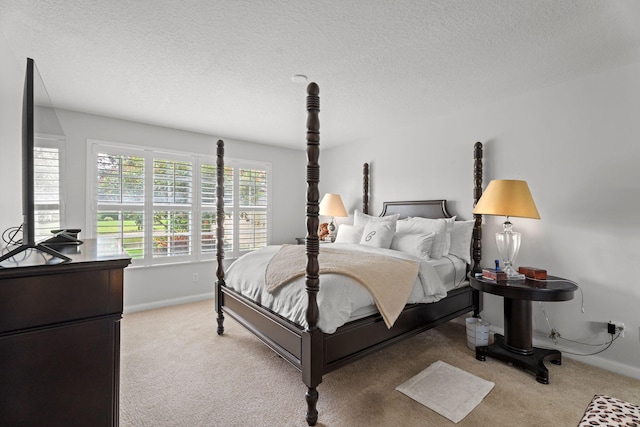 649 Hudson Bay Dr, Palm Beach Gardens, FL 33410 - bedroom featuring light carpet, baseboards, and a textured ceiling