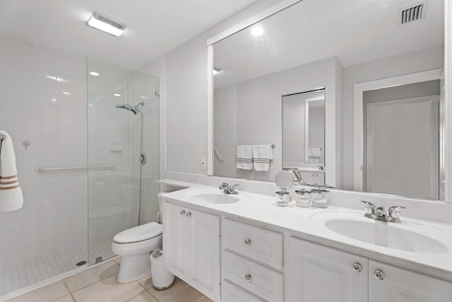 649 Hudson Bay Dr, Palm Beach Gardens, FL 33410 - bathroom with a stall shower, double vanity, toilet, and tile patterned floors
