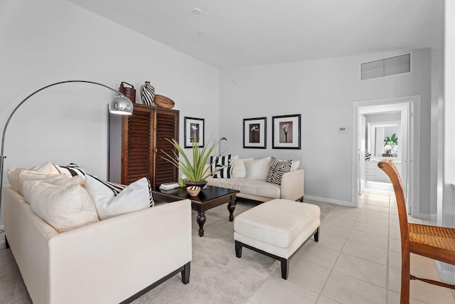 649 Hudson Bay Dr, Palm Beach Gardens, FL 33410 - living area with baseboards and light tile patterned floors