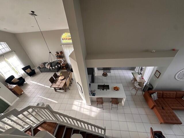 9202 Olmstead Dr, Lake Worth, FL 33467 - tiled living room with lofted ceiling