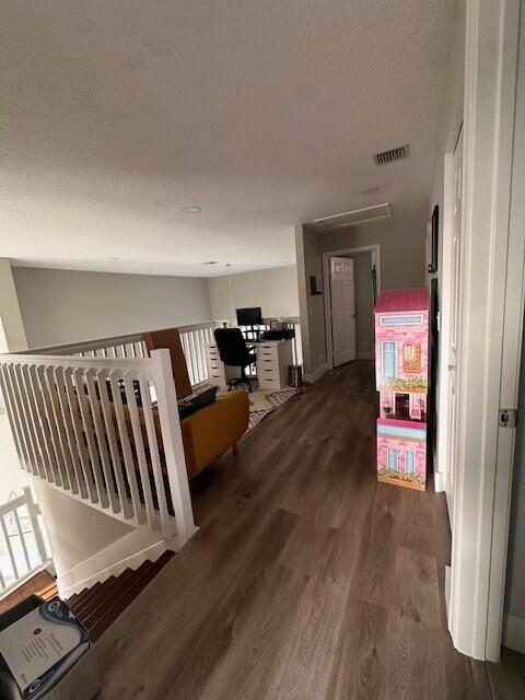 9202 Olmstead Dr, Lake Worth, FL 33467 - hall with wood finished floors, attic access, and an office area