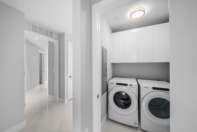 3100 N Ocean Dr Unit H-1708, Singer Island, FL 33404 - laundry area featuring washer and clothes dryer, baseboards, and cabinet space