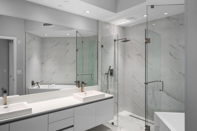 3100 N Ocean Dr Unit H-1708, Singer Island, FL 33404 - full bath with double vanity, a freestanding tub, a marble finish shower, marble tiled flooring, and recessed lighting