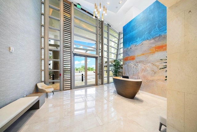 3100 N Ocean Dr Unit H-1708, Singer Island, FL 33404 - common area featuring a towering ceiling