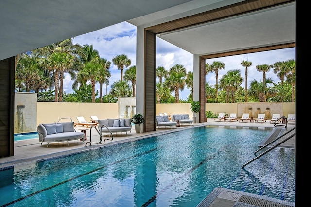 3100 N Ocean Dr Unit H-1708, Singer Island, FL 33404 - view of swimming pool with an outdoor living space and a patio