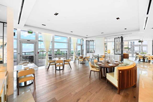 3100 N Ocean Dr Unit H-1708, Singer Island, FL 33404 - dining room with plenty of natural light, light wood-style floors, and floor to ceiling windows