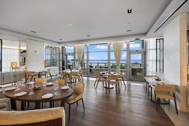 3100 N Ocean Dr Unit H-1708, Singer Island, FL 33404 - dining space featuring floor to ceiling windows and wood finished floors