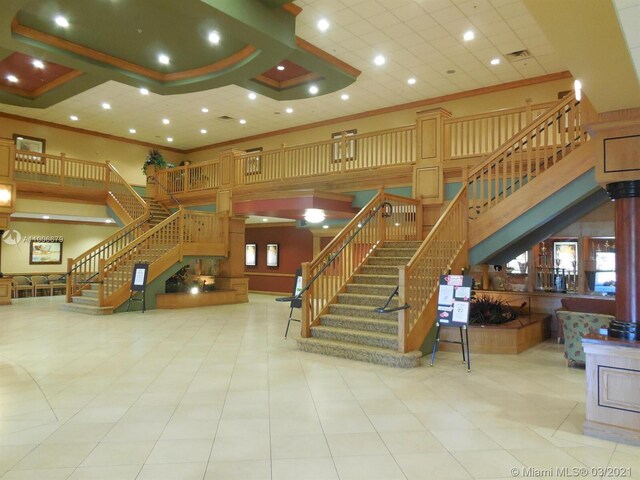 212 Somerset K, West Palm Beach, FL 33417 - common area featuring stairs, a high ceiling, ornamental molding, and recessed lighting