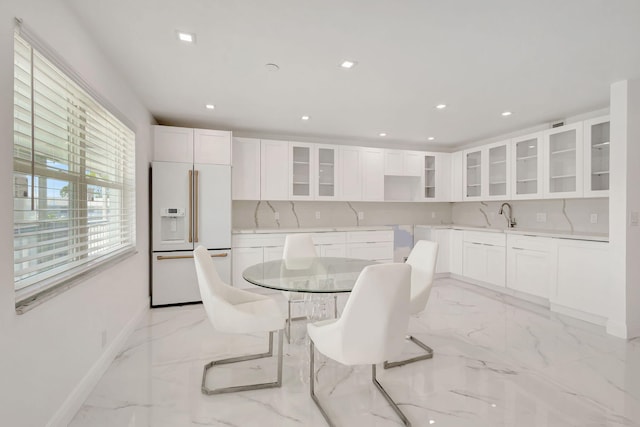 20 Somerset Unit A, West Palm Beach, FL 33417 - dining area with light marble finish floors, baseboards, and recessed lighting