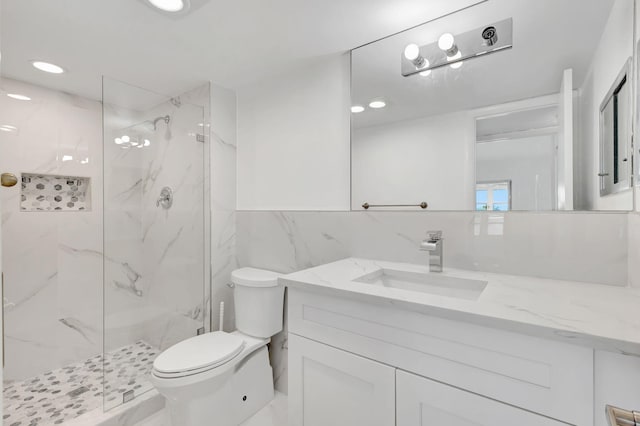 20 Somerset Unit A, West Palm Beach, FL 33417 - full bath featuring vanity, toilet, a marble finish shower, tile walls, and recessed lighting