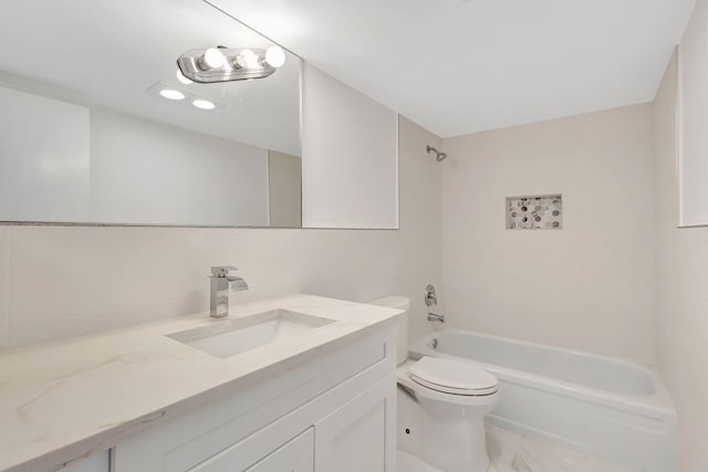 20 Somerset Unit A, West Palm Beach, FL 33417 - bathroom featuring toilet, vanity, washtub / shower combination, and marble finish floors