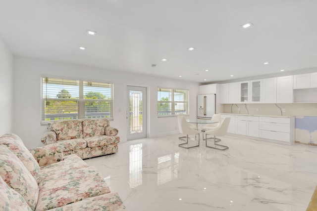 20 Somerset Unit A, West Palm Beach, FL 33417 - living room with light marble finish floors and recessed lighting